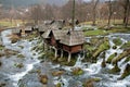 Forest river and wooden water mills