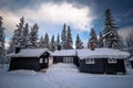 Forest scandinavian cabin in snowy woodland. Winter in Norway Royalty Free Stock Photo