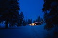 Forest scandinavian cabin in snowy woodland. Winter in Norway Royalty Free Stock Photo