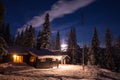 Forest scandinavian cabin in snowy woodland. Winter in Norway Royalty Free Stock Photo