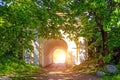 Forest and stone arch exit light. Light at the end of the tunnel. Royalty Free Stock Photo