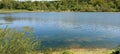 Forest trees silhouette reflection on the quiet lake surface, very peaceful, no people, lake reflection background Royalty Free Stock Photo