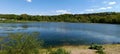 Forest trees silhouette reflection on the quiet lake surface, very peaceful, no people, lake reflection background Royalty Free Stock Photo