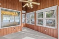 Forest trees visible through the large windows inside the lakefront home