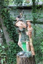 a forest troll with a snail on his head Royalty Free Stock Photo