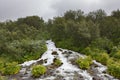 Forest waterfall falling down from the hill. Royalty Free Stock Photo