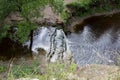 Forest waterfall and river Sablinka bird`s-eye view. Sablino, Leningrad Region, Russia. Waterfall river scene Royalty Free Stock Photo