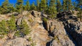 Forested Granite Cliffs Above Spring Creek, Royalty Free Stock Photo