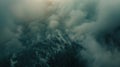 A forested mountain range blanketed in a dense layer of smoke creating an eerie otherworldly atmosphere Royalty Free Stock Photo