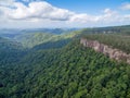 Forested mountains and rugged cliffs.