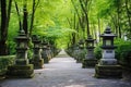 forested museum garden walkway marked by a series of stone lanterns