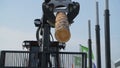 A forestry machine loads a log truck at the site landing. Forest machine down logs Royalty Free Stock Photo