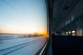 Forests and fields in the rays of dawn through the window of a speeding train Royalty Free Stock Photo