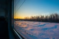 Forests and fields in the rays of dawn through the window of a speeding train Royalty Free Stock Photo