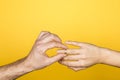 Forever together. close up of man hand putting an engagement ring on a woman hand Royalty Free Stock Photo