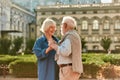 Forever together. Happy senior couple dancing and smiling while standing outdoors Royalty Free Stock Photo