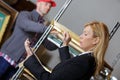 Forewoman giving orders to worker in shed