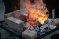Forge fireplace with red-hot metal and coals Royalty Free Stock Photo