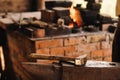 Forge, hammer on an anvil standing on the street Royalty Free Stock Photo
