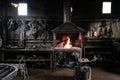 Forge, production workshop. Blacksmith tools and hot metal. Royalty Free Stock Photo