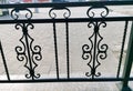 Element of forged metal fence in the city