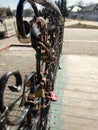 Forged bridge for lovers with wedding locks in the shape of a heart. Royalty Free Stock Photo