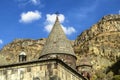 Forged cross on dome on the Church of Katoghike, against the rocks and blue sky in Geghard monastery of in Armenia Royalty Free Stock Photo