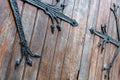 Forged door pattern, decorative. Old vintage entrance, massive heavy wooden door of church or cathedral