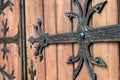 Forged door pattern, decorative. Old vintage entrance, massive heavy wooden door of church or cathedral