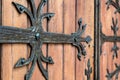 Forged door pattern, decorative. Old vintage entrance, massive heavy wooden door of church or cathedral