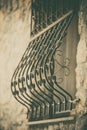 Forged iron decorations in front of a window Royalty Free Stock Photo