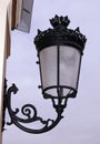 Forged, iron lantern at the entrance to the royal palace