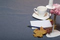 Forged metal candlestick with candles. There is an open notepad and a pen. A cup with unapproved coffee. Fallen autumn leaves of y Royalty Free Stock Photo