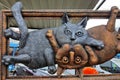 Forged metal figurines, 2 funny unusual iron cats are shown at exhibition Koval fest. Decorative metal products sculpture art