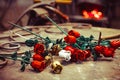 A metal forged rose lies on the pier in the smithy Royalty Free Stock Photo