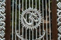 Forged metallic silver yoga and meditation sign 1