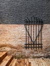 Forged steel metal decorative grille on a brick wall