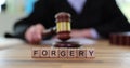 Forgery word judge with gavel in court