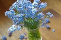 Forget me nots in the green vase