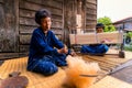 Forging the cotton and making mudmee cotton. White cotton wool and spinning yarn from cotton. Process of weaving, dyeing, weaving