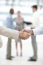 Forging new corporate partnerships. Cropped view of two businesspeople shaking hands. Royalty Free Stock Photo