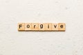 Forgive word written on wood block. Forgive text on cement table for your desing, Top view concept Royalty Free Stock Photo