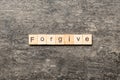 Forgive word written on wood block. Forgive text on cement table for your desing, Top view concept Royalty Free Stock Photo
