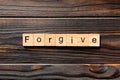 Forgive word written on wood block. Forgive text on wooden table for your desing, Top view concept Royalty Free Stock Photo