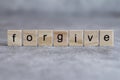 Forgive word written on wood cube