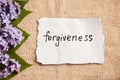 Forgiveness concept on beautiful background with flowers Royalty Free Stock Photo