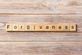 Forgiveness word written on wood block. forgiveness text on table, concept Royalty Free Stock Photo