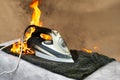 Forgotten included electric iron for ironing clothes. Careless handling of household appliances can cause a fire. Household fire