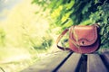 Forgotten leather hand bag on a park bench, nobody Royalty Free Stock Photo