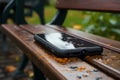 Forgotten smartphone on park bench, a story of a lost connection